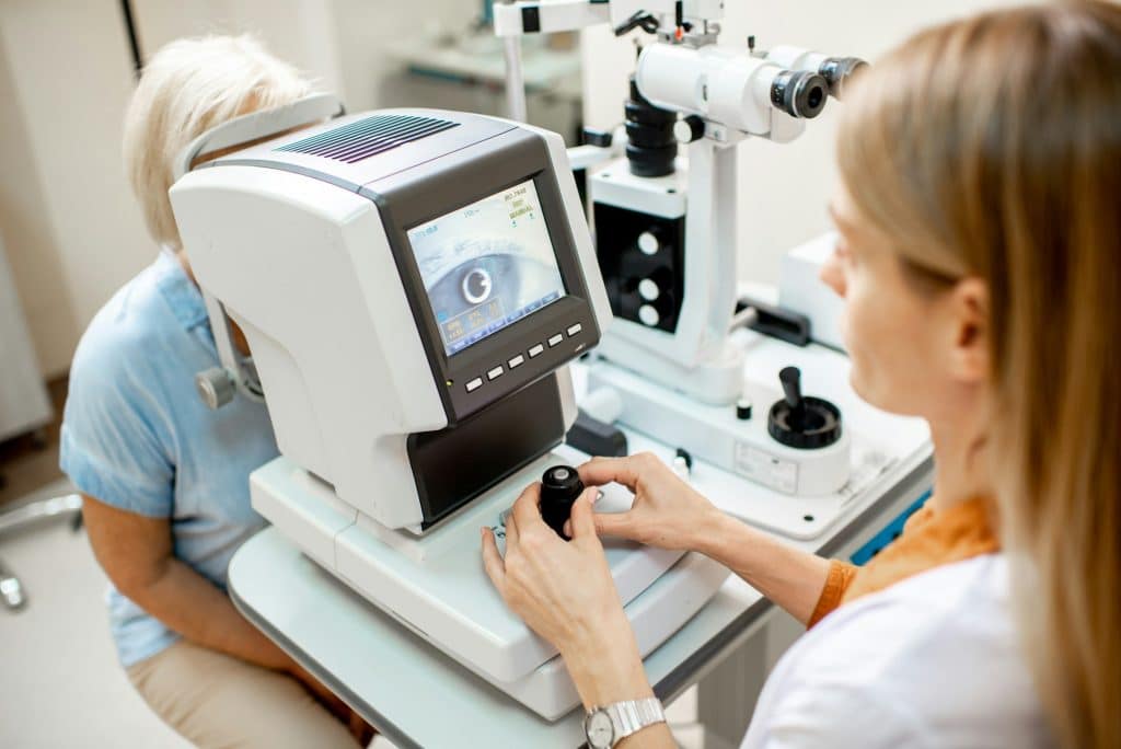 Ophthalmologist examining eyes with digital microscope