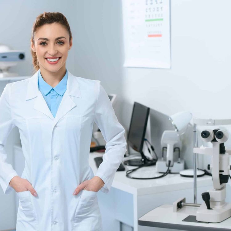 smiling-female-optometrist-posing-in-optical-clini-2021-08-29-21-06-51-utc-e1661265797902.jpg